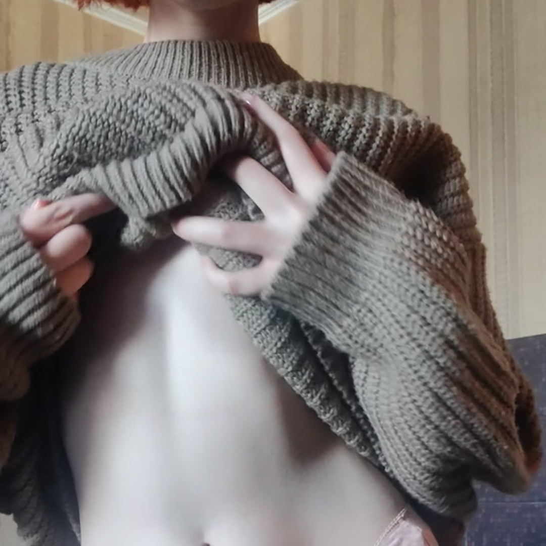 petite redhead about to take shirt off