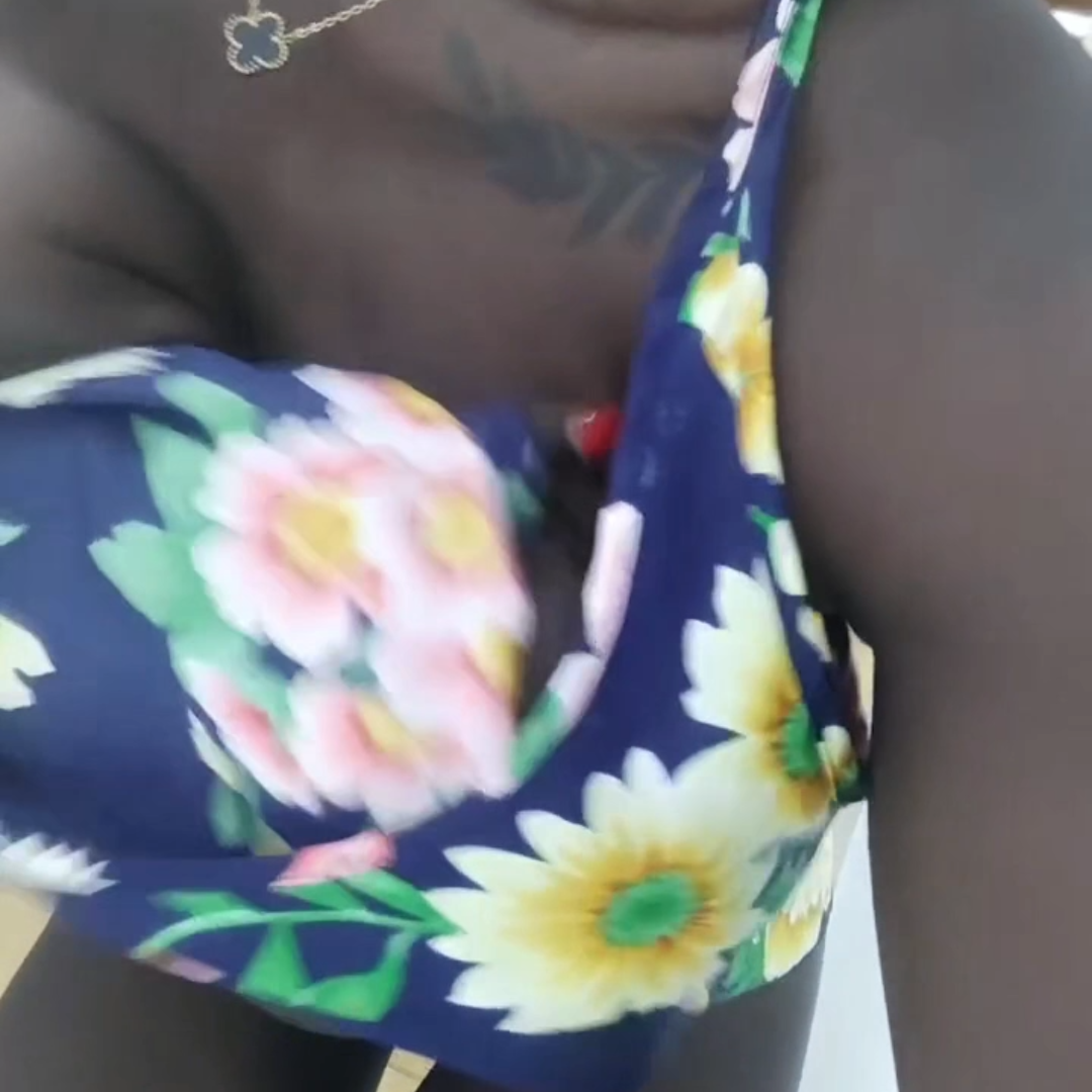 black woman wearing a sun dress